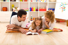 http://www.dreamstime.com/stock-photos-happy-family-reading-kids-room-image13333203